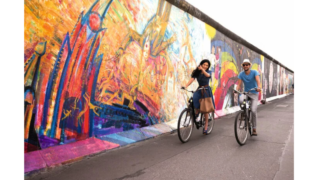 two bikers at the east side wall in berlin
